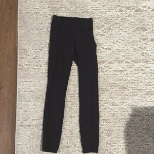 Black Lululemon Wunder train with pockets leggings.